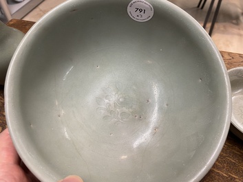 A Chinese celadon-glazed bottle vase and two bowls, Yuan/Ming