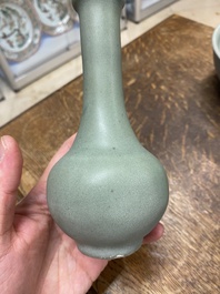 A Chinese celadon-glazed bottle vase and two bowls, Yuan/Ming