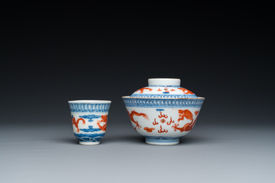 A Chinese blue, white and iron-red 'dragon' bowl and cover and a wine cup, Qianlong mark, 18/19th C.