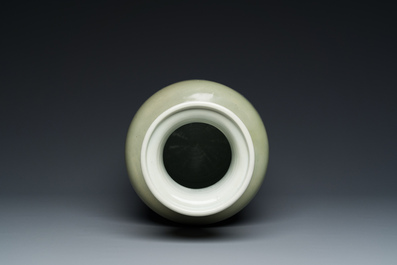A Chinese celadon-ground blue, white and copper-red rouleau vase, Kangxi