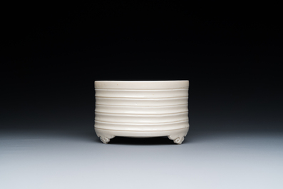 A Chinese Dehua blanc de Chine tripod censer, Kangxi