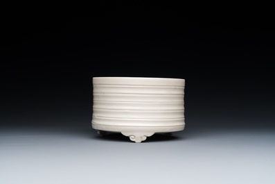 A Chinese Dehua blanc de Chine tripod censer, Kangxi