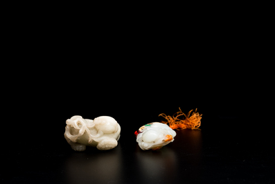 Two Chinese white and celadon jade carved standing boys, Qing