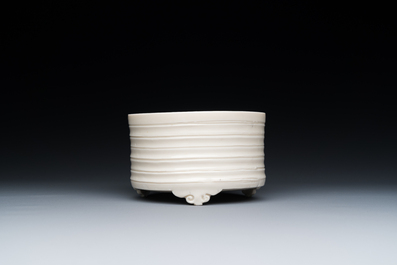 A Chinese Dehua blanc de Chine tripod censer, Kangxi