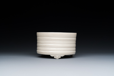 A Chinese Dehua blanc de Chine tripod censer, Kangxi