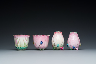 Two Chinese relief-decorated famille rose 'lotus' cups and saucers and two jugs, Yongzheng