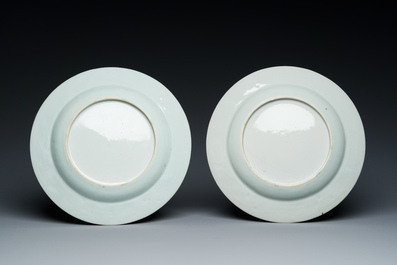 A pair of Chinese famille rose plates with peasants playing cards in the style of the painter David Teniers II, Qianlong