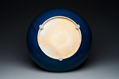 A very large Chinese monochrome blue-glazed dish, Kangxi
