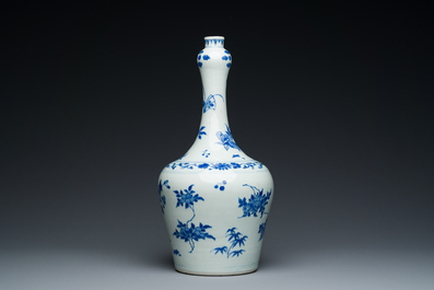 A Chinese blue and white bottle vase with floral designs, Transitional period