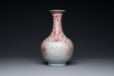 A Chinese copper-red bottle vase with floral scrolls, Qianlong