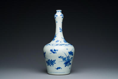 A Chinese blue and white bottle vase with floral designs, Transitional period