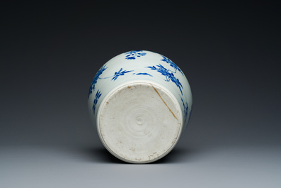 A Chinese blue and white bottle vase with floral designs, Transitional period