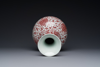 A Chinese copper-red bottle vase with floral scrolls, Qianlong