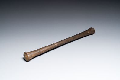 A large French bronze mortar and pestle on its carved oak base, dated 1631