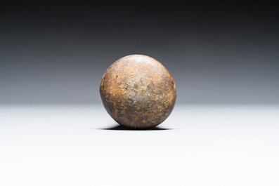 A large French bronze mortar and pestle on its carved oak base, dated 1631