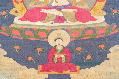 A Chinese kesi silk weaving depicting 'Buddha sitting on a lotus throne', Qing