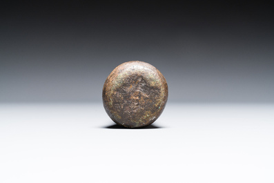 A large French bronze mortar and pestle on its carved oak base, dated 1631