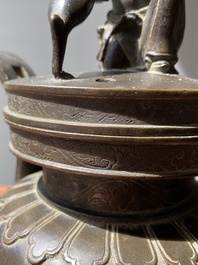 A Chinese bronze tripod censer with Liu Hai and the toad, Yuan