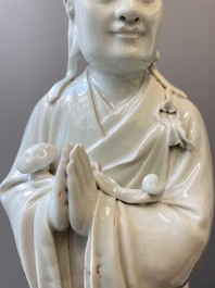 Two exceptionally tall Chinese white-glazed sculptures of Luohan, Qianlong/Jiaqing
