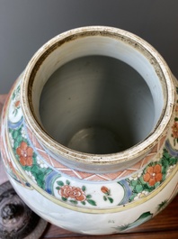 A Chinese famille verte vase with reticulated wooden cover and stand, Kangxi
