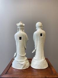 Two exceptionally tall Chinese white-glazed sculptures of Luohan, Qianlong/Jiaqing