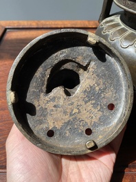 A Chinese bronze tripod censer with Liu Hai and the toad, Yuan