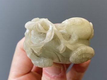 Two Chinese white and celadon jade carved standing boys, Qing