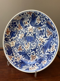 A Chinese blue, white and copper red 'crab and fish' dish, Kangxi