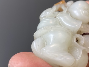 Two Chinese white and celadon jade carved standing boys, Qing