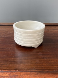 A Chinese Dehua blanc de Chine tripod censer, Kangxi