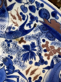 A Chinese blue, white and copper red 'crab and fish' dish, Kangxi