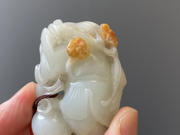Two Chinese white and celadon jade carved standing boys, Qing