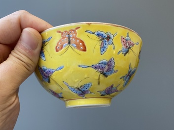 Four Chinese famille rose yellow-ground 'butterfly' bowls, Tongzhi mark and of the period