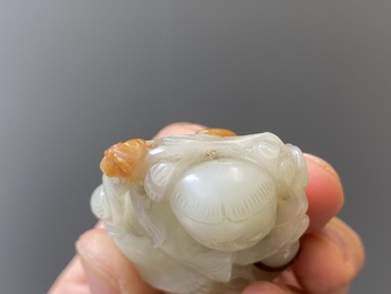 Two Chinese white and celadon jade carved standing boys, Qing