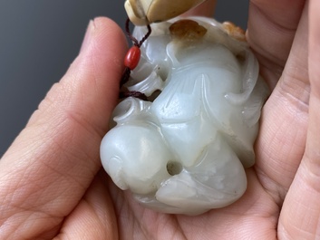 Two Chinese white and celadon jade carved standing boys, Qing
