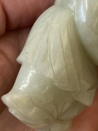 Two Chinese white and celadon jade carved standing boys, Qing