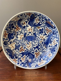 A Chinese blue, white and copper red 'crab and fish' dish, Kangxi