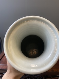 A Chinese celadon-ground blue, white and copper-red rouleau vase, Kangxi