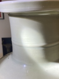 A Chinese celadon-ground blue, white and copper-red rouleau vase, Kangxi
