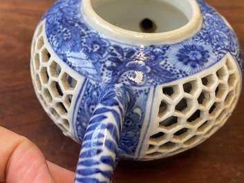 A pair of Chinese reticulated and double-walled blue and white teapots, Transitional period
