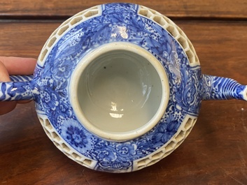 A pair of Chinese reticulated and double-walled blue and white teapots, Transitional period