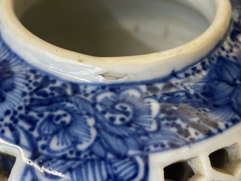 A pair of Chinese reticulated and double-walled blue and white teapots, Transitional period