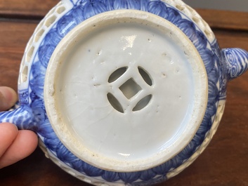 A pair of Chinese reticulated and double-walled blue and white teapots, Transitional period