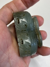A Chinese reticulated white jade parfumier with spinach-green jade cover and base, Qing