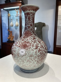 A Chinese copper-red bottle vase with floral scrolls, Qianlong