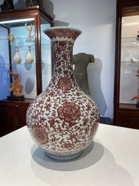 A Chinese copper-red bottle vase with floral scrolls, Qianlong