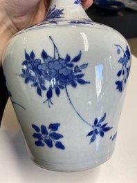A Chinese blue and white bottle vase with floral designs, Transitional period