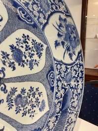 An exceptionally large Chinese blue and white 'peacock rim' dish, Kangxi