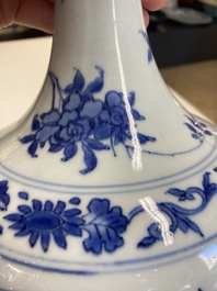 A Chinese blue and white bottle vase with floral designs, Transitional period