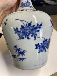 A Chinese blue and white bottle vase with floral designs, Transitional period